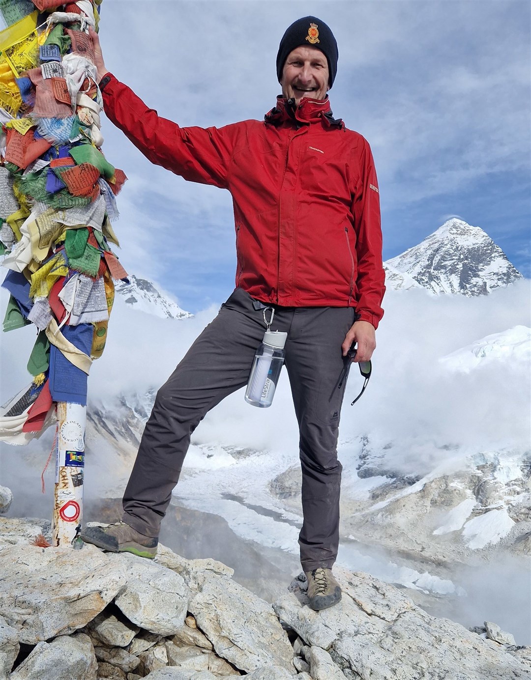 Stephen Wiltshire at the 5643 meter summit of Kala Patthar, with Everest over his left shoulder.