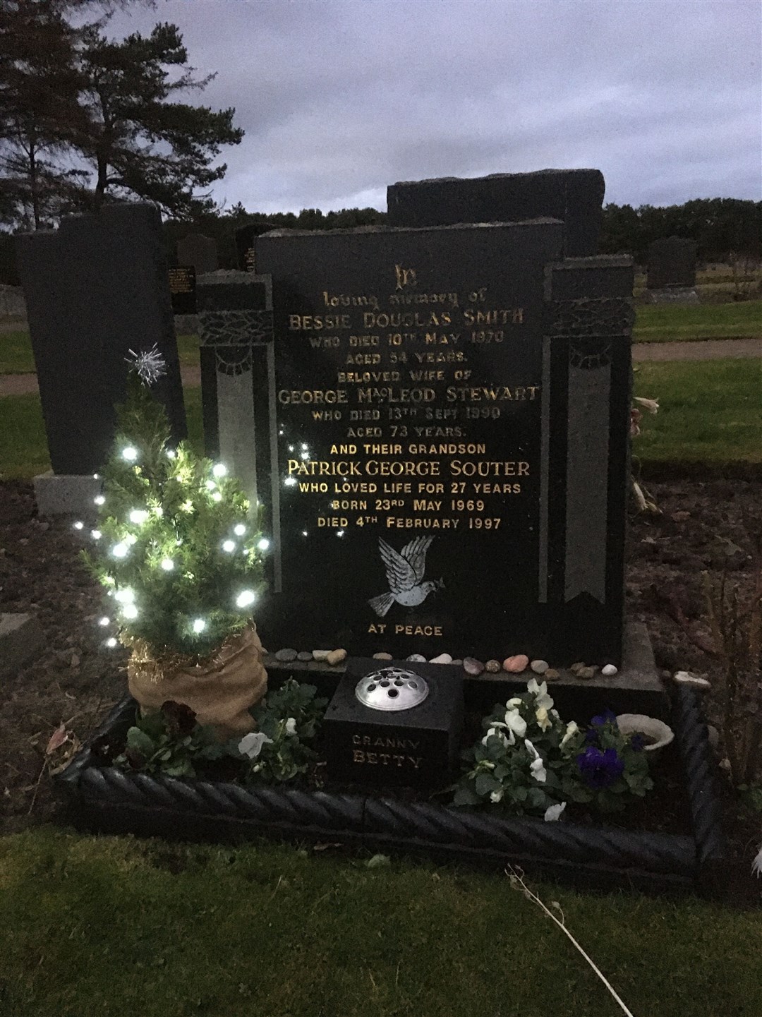 The lit-up tree at the grave of Patrick Souter at Lossiemouth Cemetery, on Inchbroom Road.