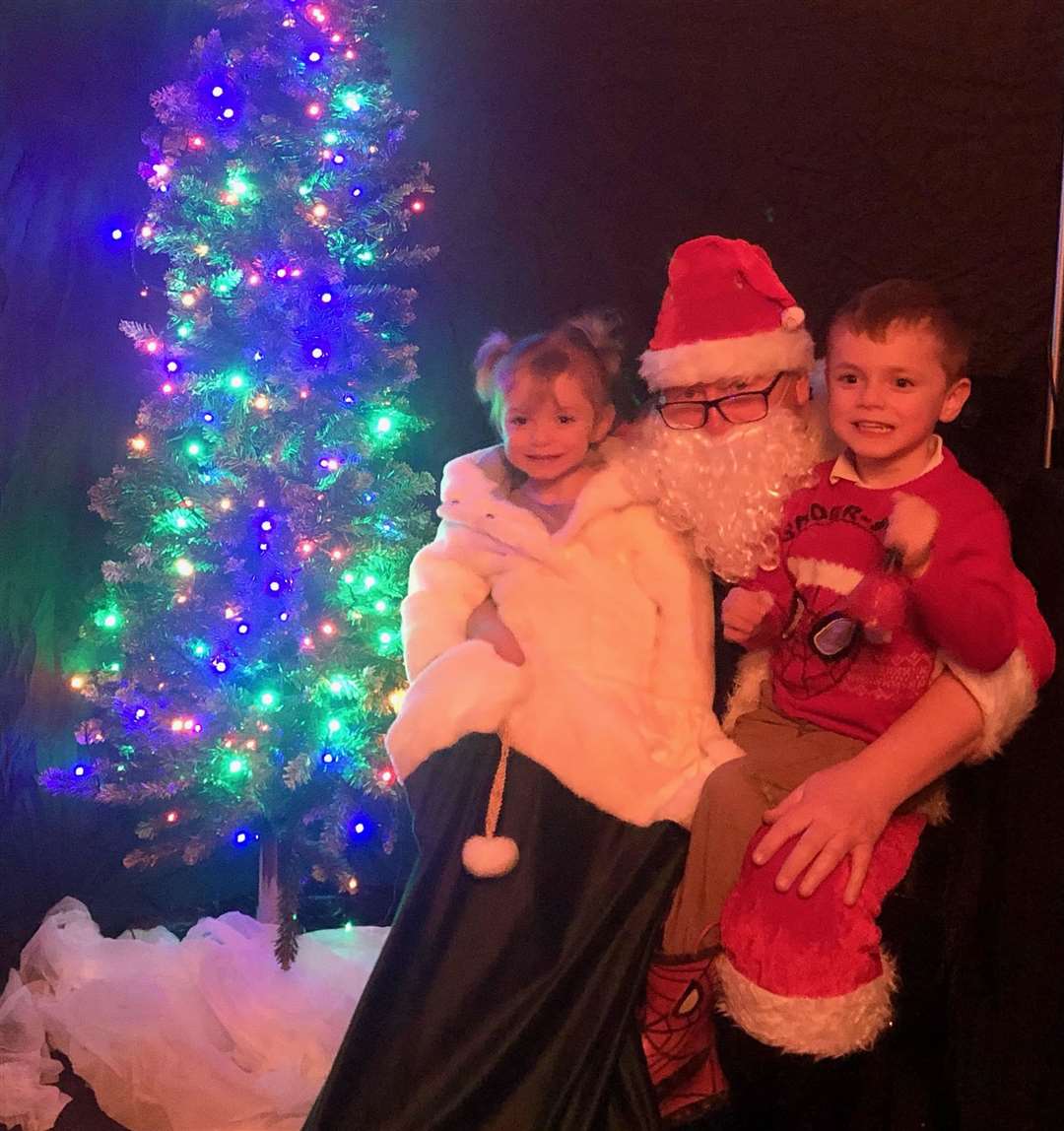 Faith and Tyler Sherwin with Santa. Picture: Graham Cormie.