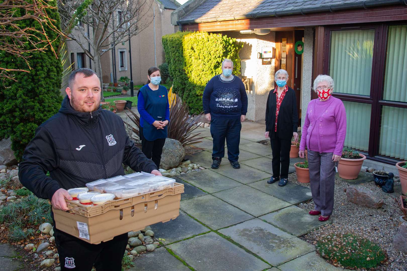 Elgin City's Craigh Stewart delivers to staff and residents at Netherport in Elgin...Elgin City FC, along with TESCO Elgin and Guidi's in Lossiemouth, hand out 130 three course meals to sheltered housing in the community...Picture: Daniel Forsyth..