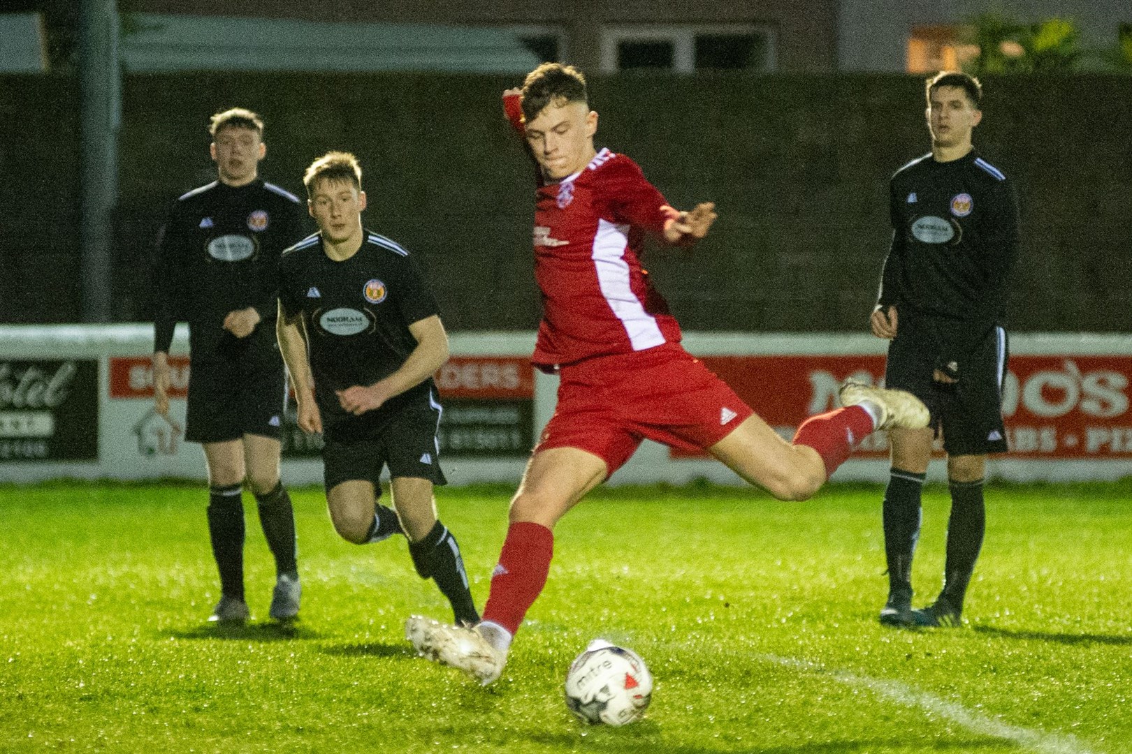 Brodie Allen opens the scoring in Lossiemouth's 2-0 win over Fort William. The teams will meet at Grant Park for a second time this weekend. Picture: Daniel Forsyth..