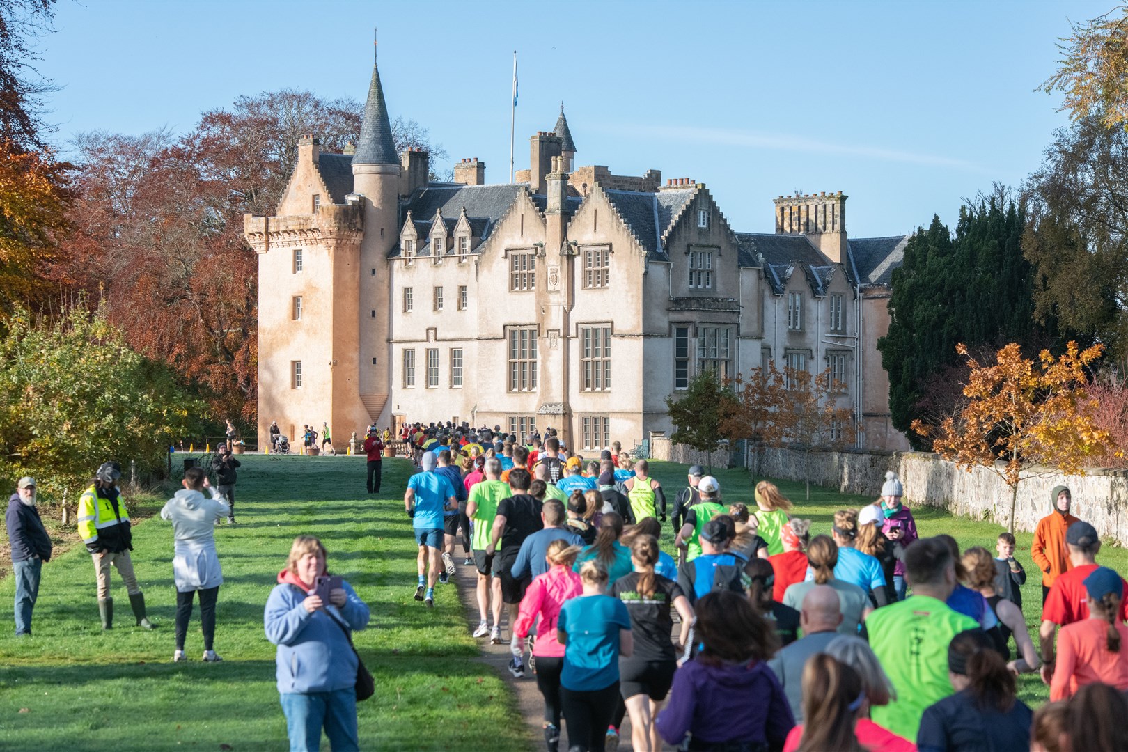 Runners head towards the castle at the start of the race. ..Forres Harriers' organised Brodie Castle 10k Race 2023...Picture: Daniel Forsyth..