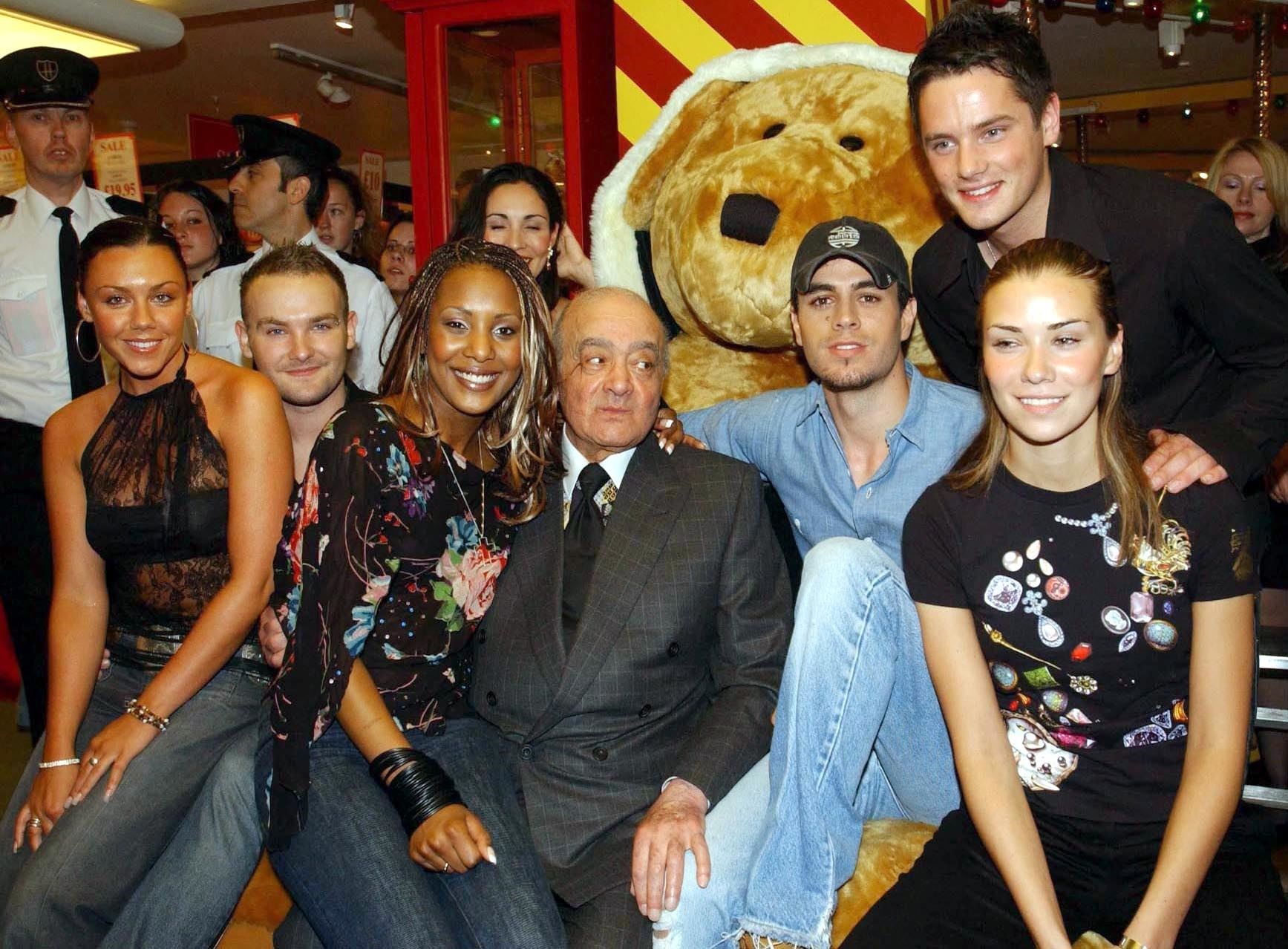 Harrods chairman Mohamed Al Fayed with pop band Liberty X and singer Enrique Iglesias in Knightsbridge (Yui Mok/PA)