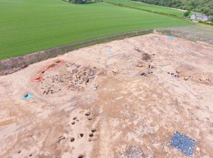Drone photograph showing three of the large Iron Age roundhouses under excavation.