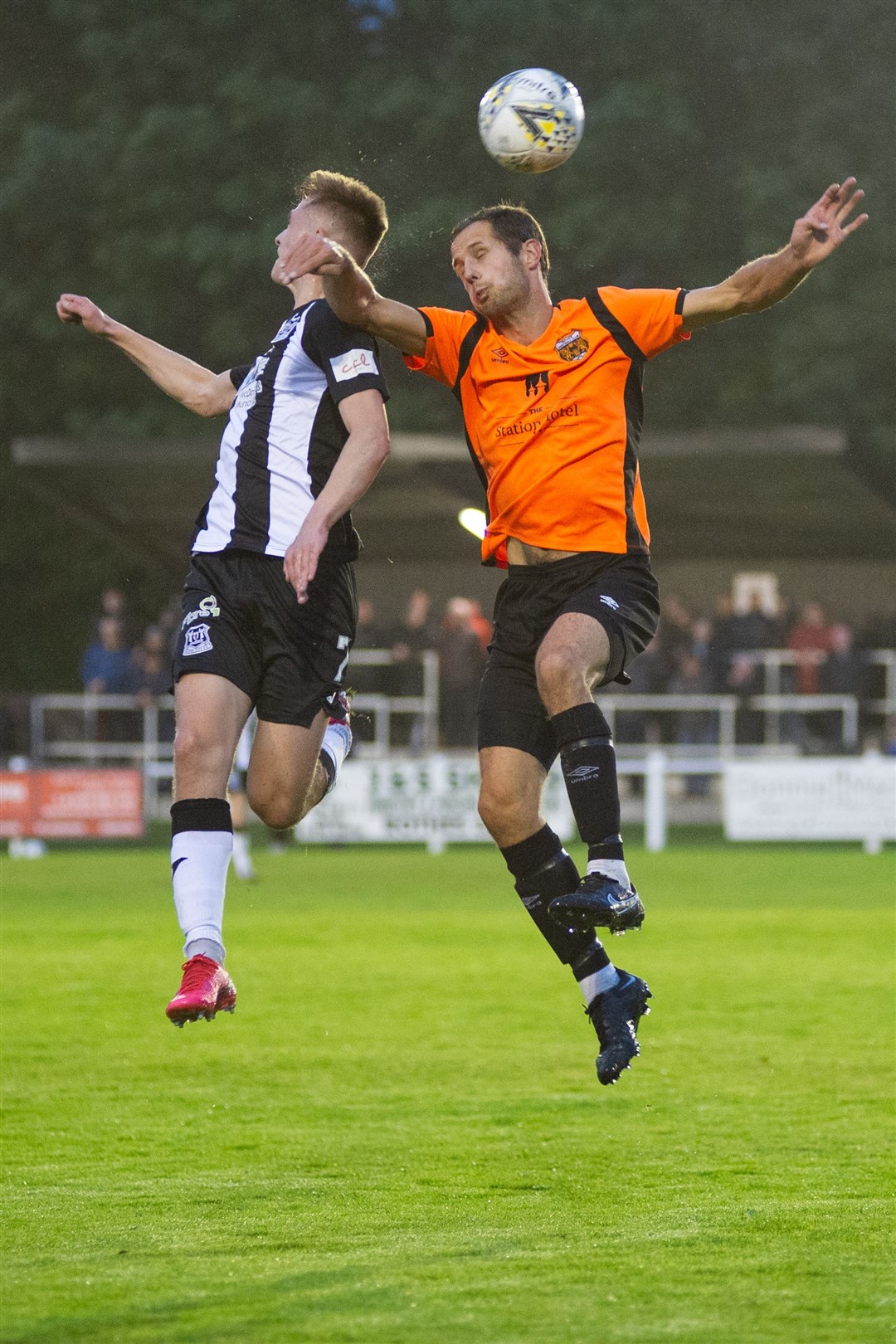 Elgin City's Joel MacBeath and Rothes' Michael Finnis fight it out in the air. Picture: Daniel Forsyth....