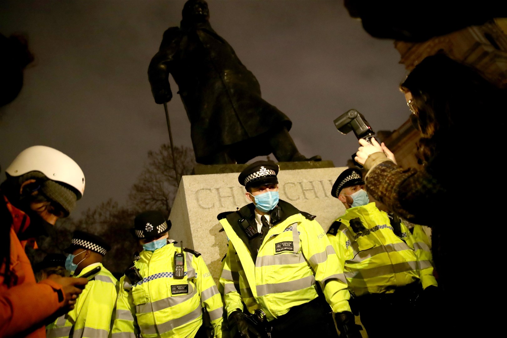 Police surround the Sir Winston Churchill statue at Parliament Square (Aaron Chown/PA)