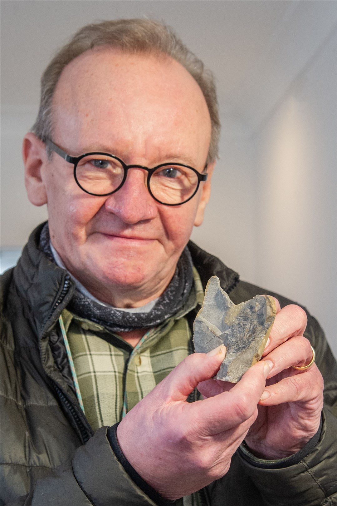 Local fossil-fish expert Bob Davidson, at Elgin Museum, holding a Devonian fish fossil from Eathie, the site made famous by Scottish geologist Hugh Miller. Picture: Daniel Forsyth.