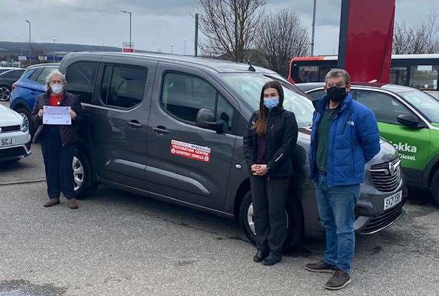 Record breaker...Lynn Fleming (left) and driver Alan Reid are joined by Jordan Legge from Regency Car Sales after they broke the 10,000-mile barrier. Picture: Regency Car Sales