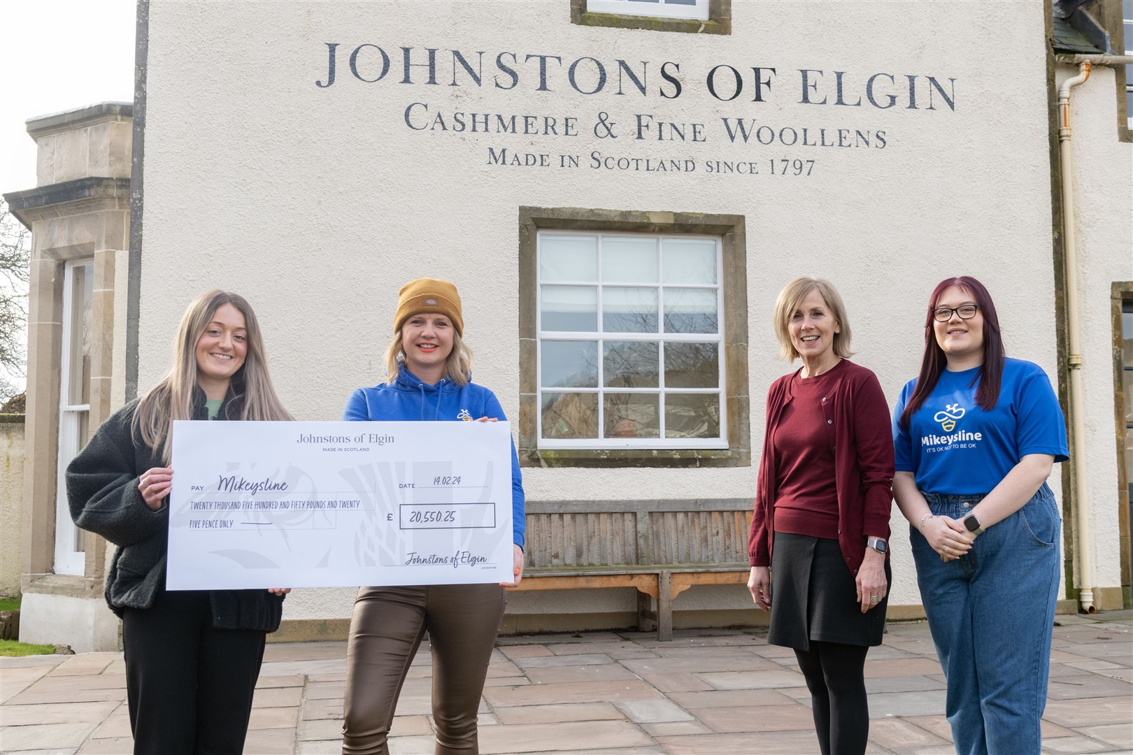 From left: Darcie Stevenson (User Experience Coordinator) with Allana Stables (Bee the Change Manager) and Julia McGlashan (People Director) with Chloe O'Connor (Fundraising and Events Coordinator). ..Johnstons of Elgin Charity Fundraising hands over a cheque for Â£20,550.25 to Mikeysline. ..Picture: Beth Taylor.