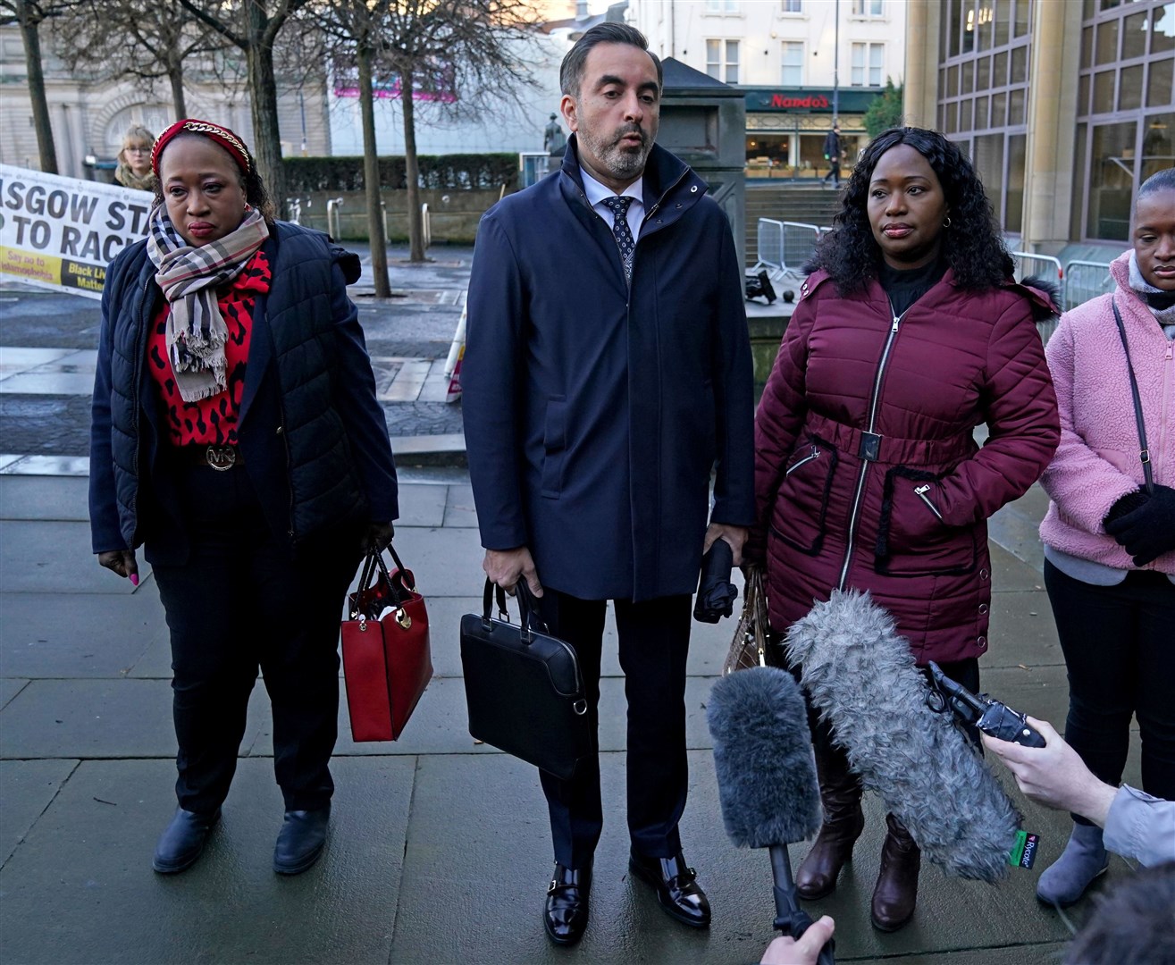 Laywer Aamer Anwar (centre) with Sheku Bayoh’s sisters Kadi Johnson (right) and Kosna Bayoh (left) arriving for an earlier hearing (Andrew Milligan/PA)