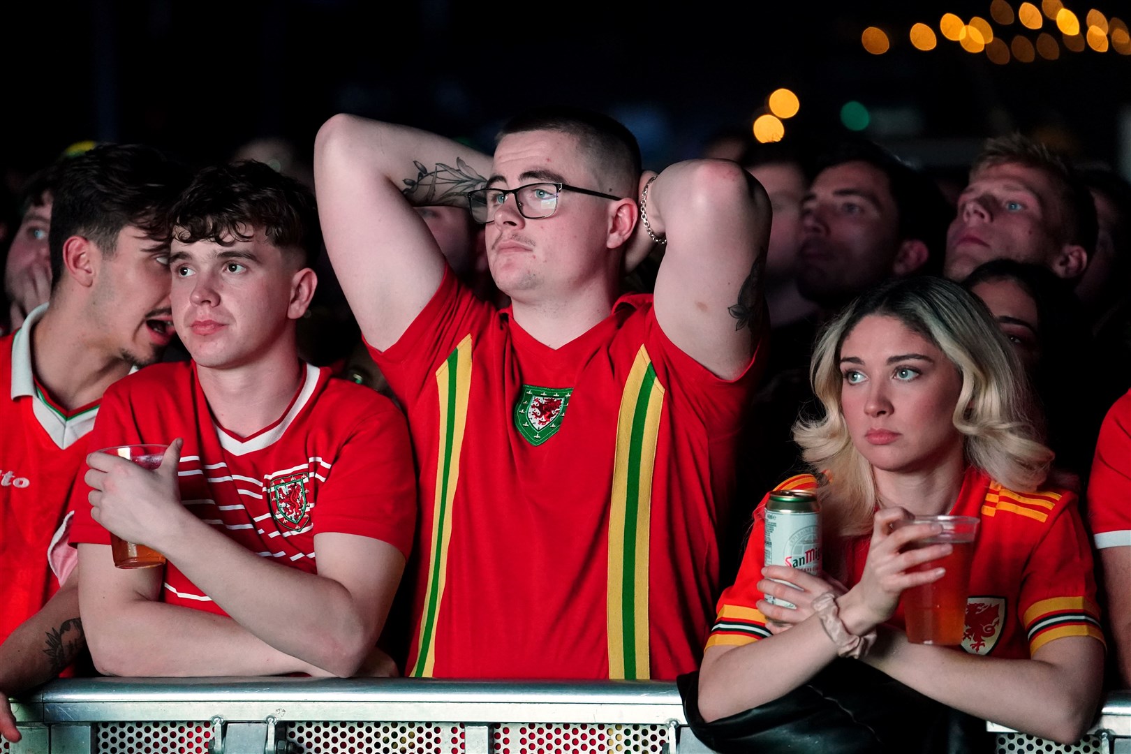 Wales fans appear dejected at the 4TheFans fan park at The Tramshed, Cardiff (David Davies/PA)