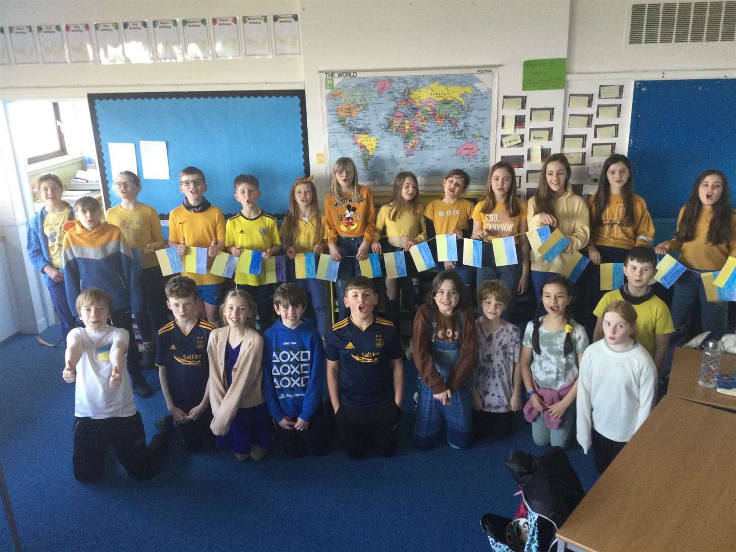Hopeman Primary's P6 class organised a fundraising day in school by asking all the children and staff to wear blue and yellow to school and make a contribution to help raise money for Ukrainian refugees.