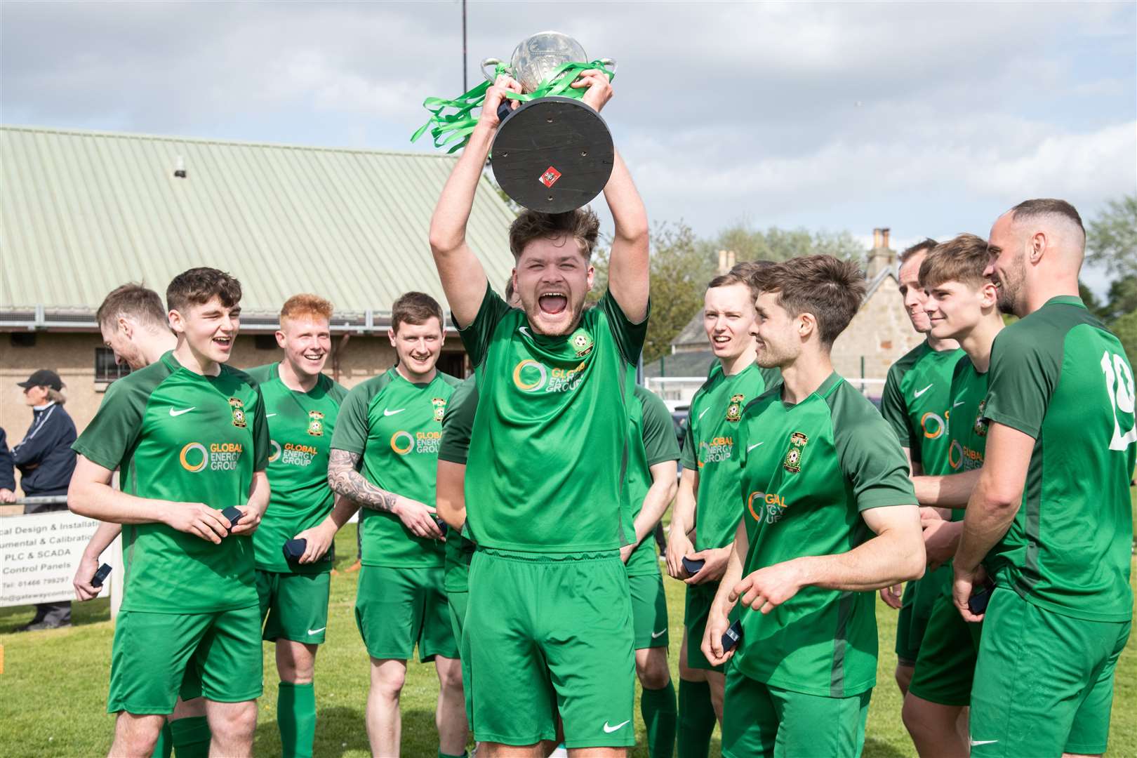 Jack Macarthur and Dufftown celebrate their Elginshire Cup success...Dufftown FC (2) vs Forres Thistle FC (2) - Dufftown FC win 5-3 on penalties - Elginshire Cup Final held at Logie Park, Forres 14/05/2022...Picture: Daniel Forsyth..