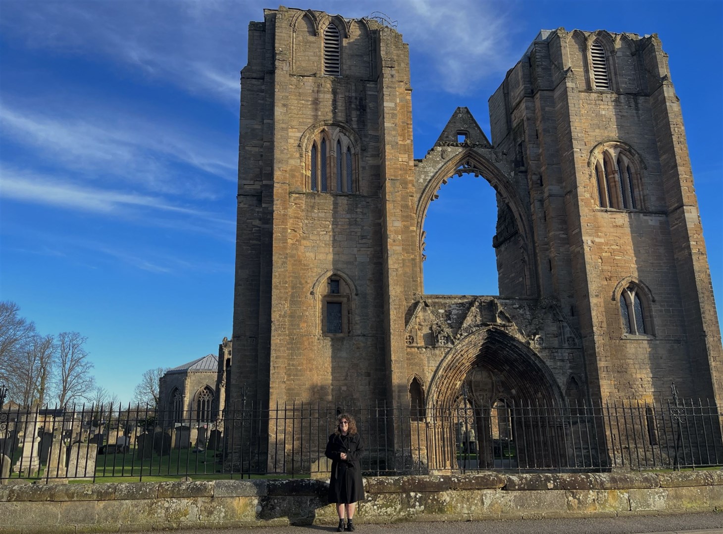 Lynda Dean outside Elgin Cathedral which forms part of her tour.