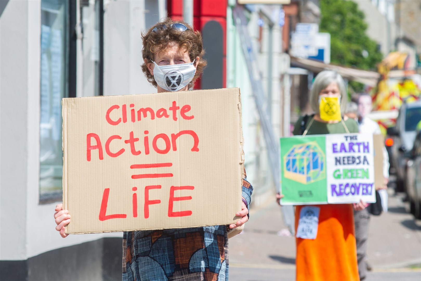 Members of the Forres Extinction Rebellion group impersonate Moray MP Douglas Ross as they hand over a letter urging for action to be taken on climate change during their socially distanced protest on Forres' High Street...Picture: Daniel Forsyth..