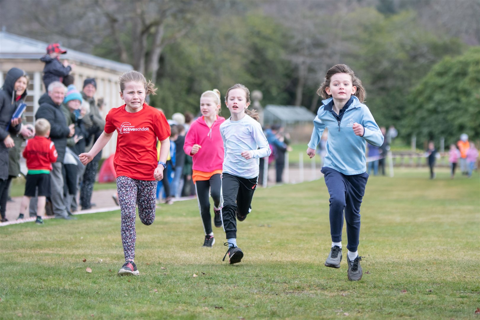 EL_PR Cross Country 2024 09On the final straight towards the finish of the Primary 1-3 Girls fun race. Active Schools Primary Cross Country 2024, held at Gordon Castle, Fochabers. Picture: Daniel Forsyth.