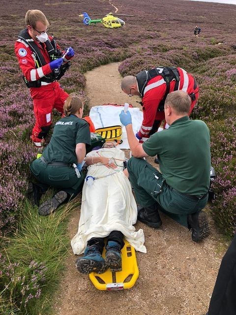 SCAA paramedics in action alongside Scottish Ambualnce Service road crew colleagues at the scene of a hillwalking accident on Benachie.
