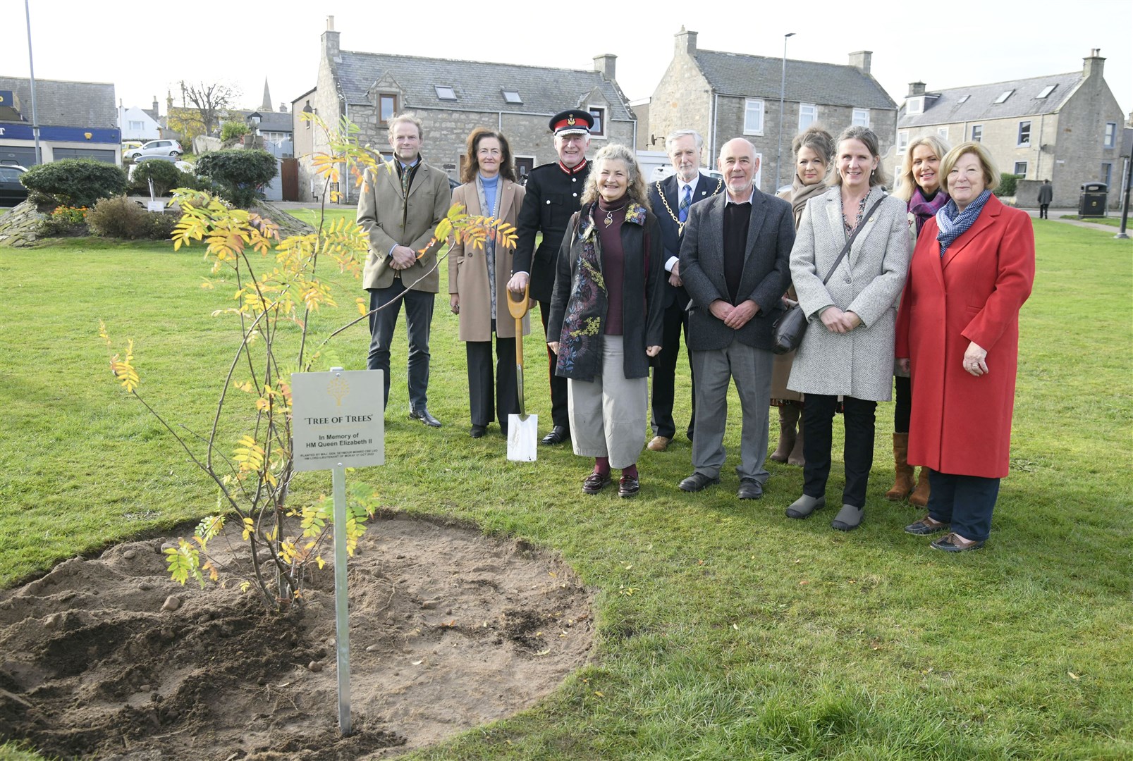 From left: John Stuart, Nancy Robson, Lord Lieutenant Seymour Monro, Helen Moore, John Cowe, George McIntrye, Joan Cowe, Rebecca Russell, Carolle Ralph and Lily Mulholland with the "Tree of Trees". Picture: Beth Taylor