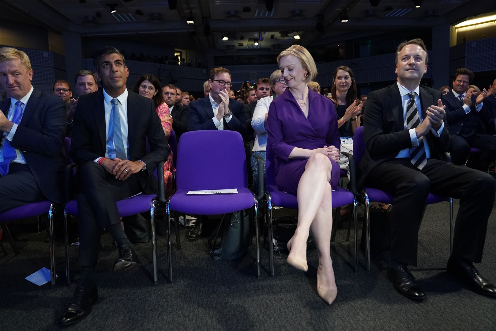 Rishi Sunak, Liz Truss and her husband Hugh O’Leary at the Queen Elizabeth II Centre in London ahead of the announcement that Ms Truss is the new Conservative Party leader and will become the next prime minister (Stefan Rousseau/PA)