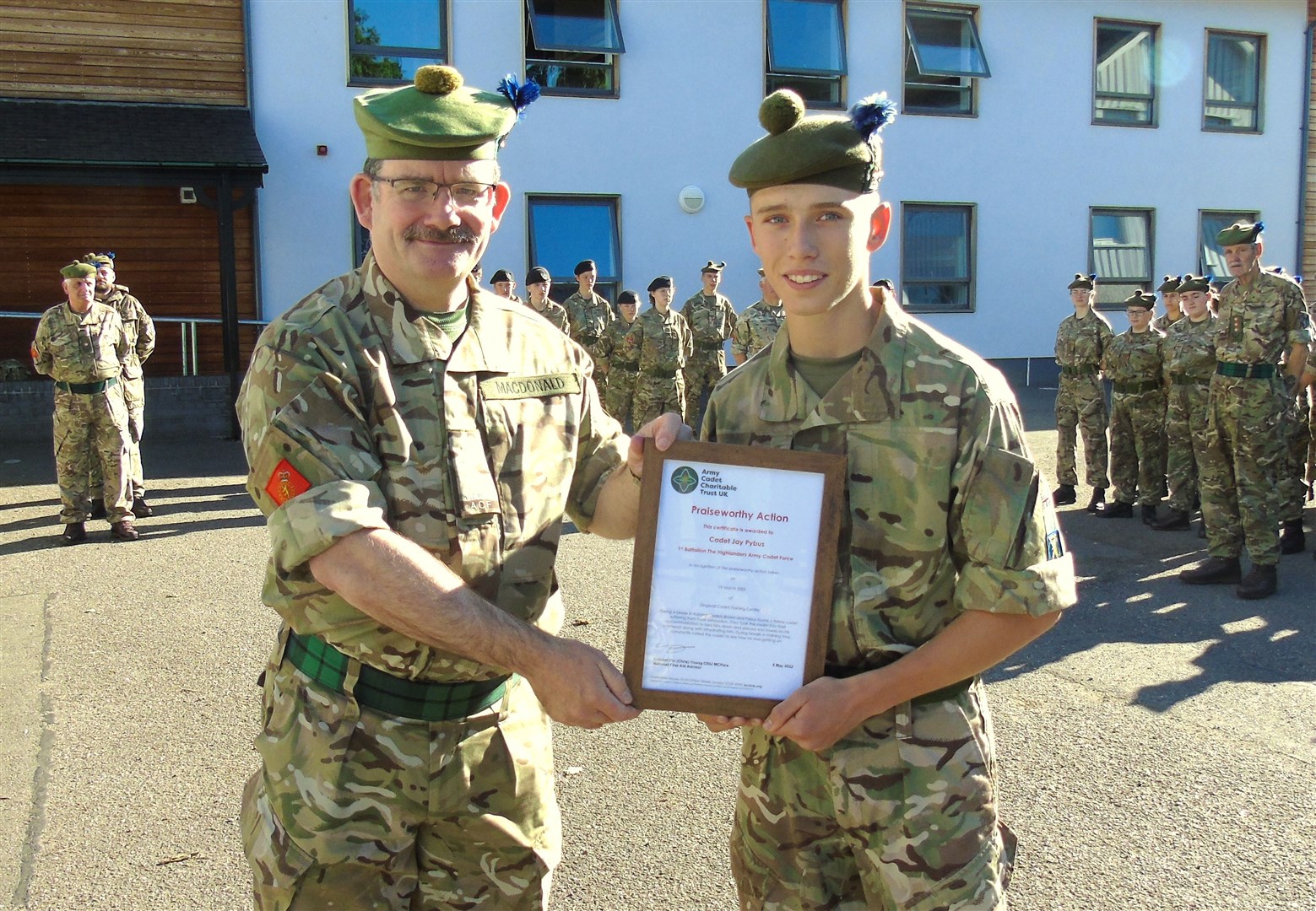 Cdt Jay Pybus (right) being presented with his ACCT Praiseworthy First Aid Certificate by the Battalion's Commandant Col Mike MacDonald.