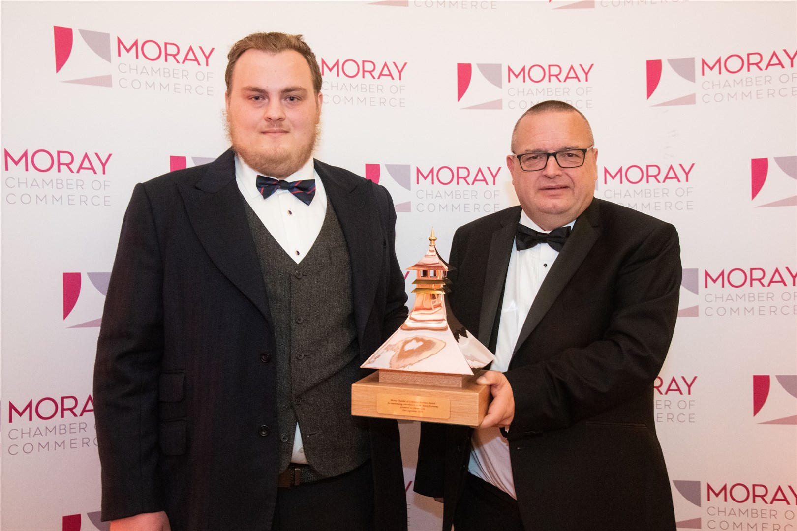 Evan Scott (left) and Garry Reaper with award...Moray Chamber of Commerce Annual Dinner 2023, held at Gordon Castle. ..Picture: Daniel Forsyth..