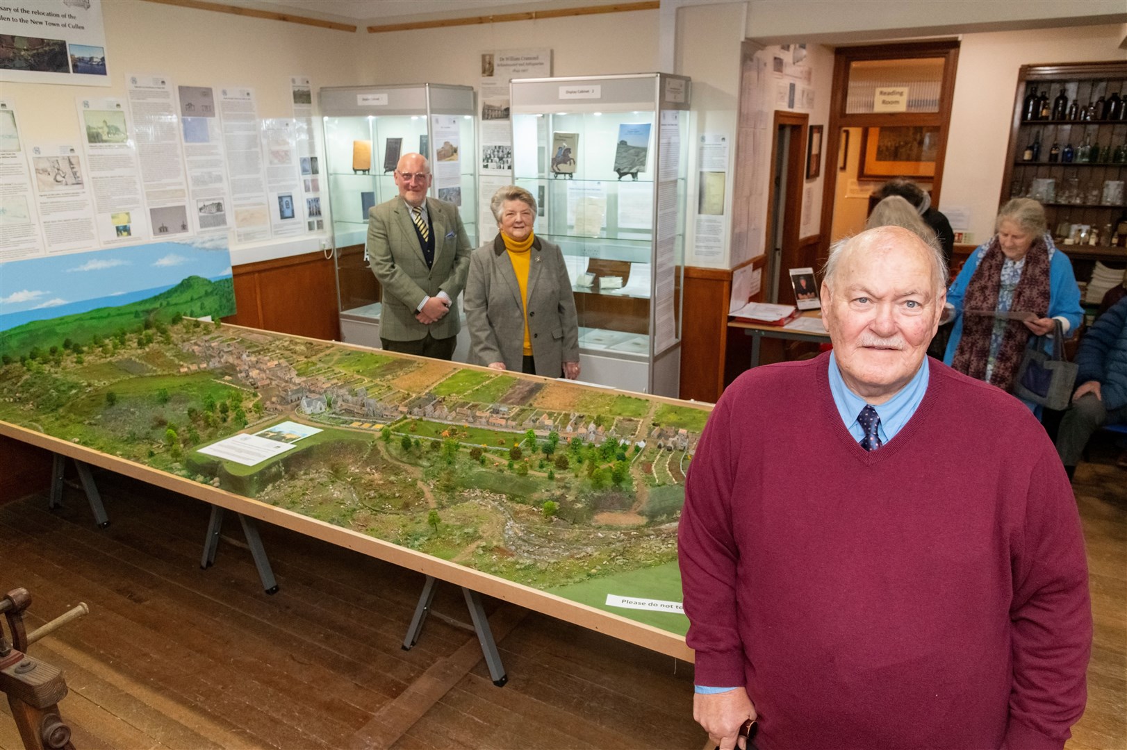John Czajkowski (front) admires the Old Cullen model along with heritage group president Brenda Wood and guest speaker Prof Peter Reid. Picture: Beth Taylor