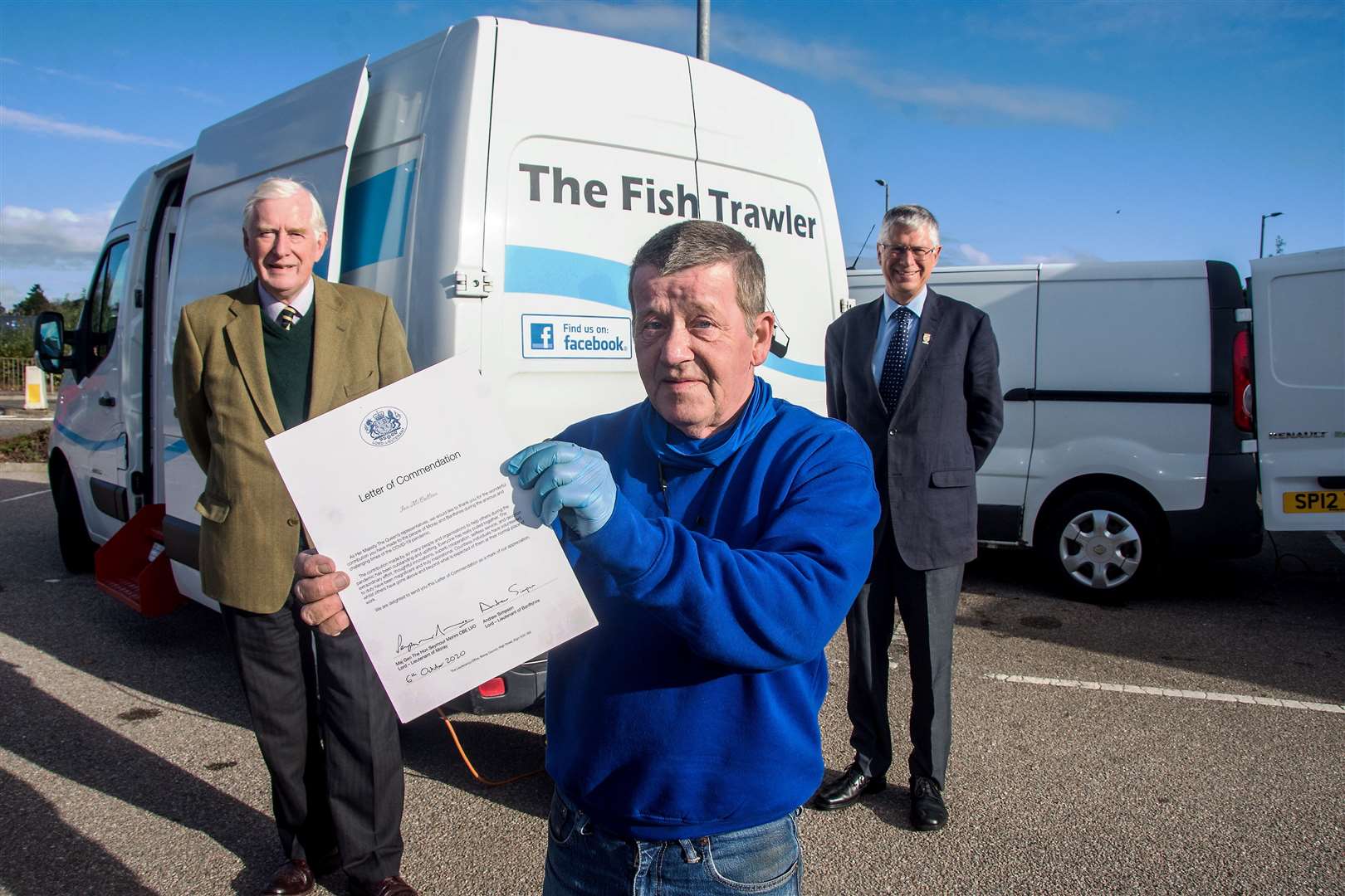 Buckie man Ian McCallion proudly shows off his commendation, joined by Seymour Monro (back left) and Andrew Simpson, the Lord-Lieutenants of Moray and Banffshire respectively. Picture: Becky Saunderson