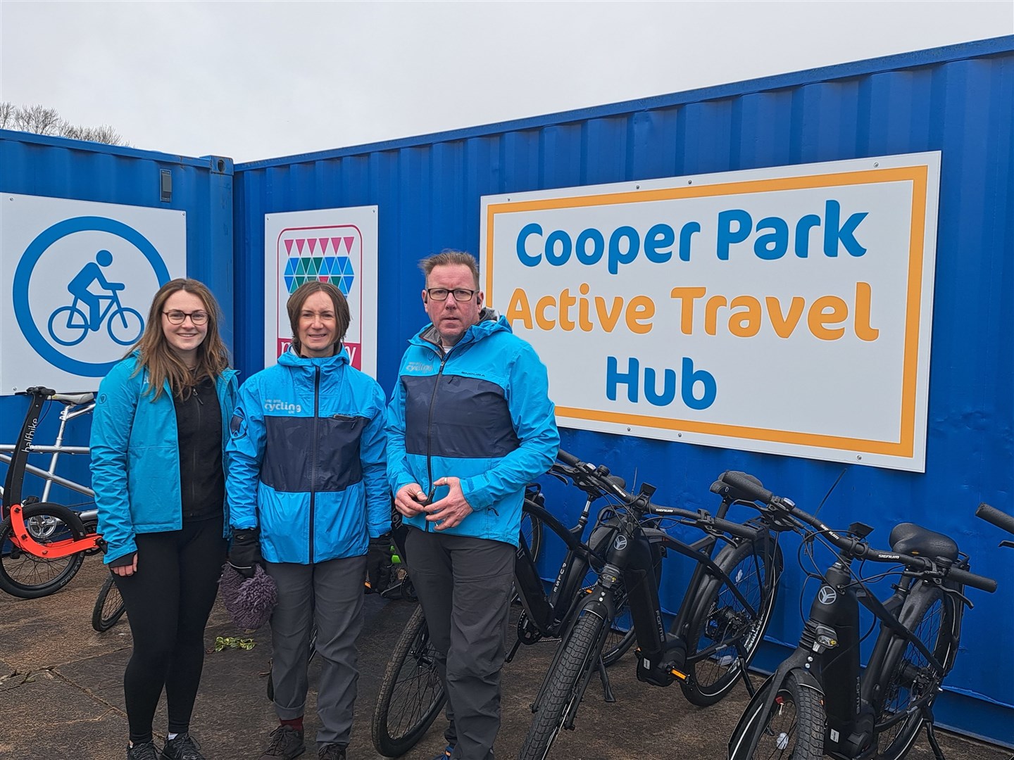 Left to right: Emily Farquhar and Suzanne Forup and Iain Bamber of Cycling UK at the travel hub.