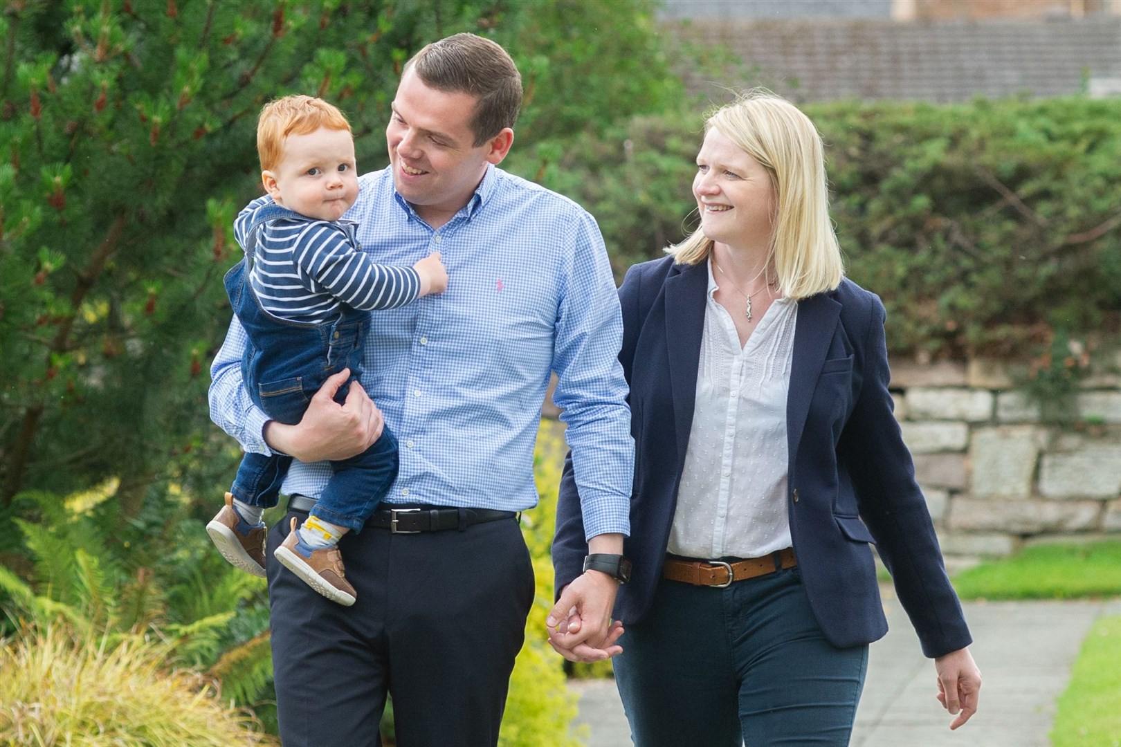 Douglas Ross with wife Krystle and son Alistair in Grant Park. Picture: Daniel Forsyth