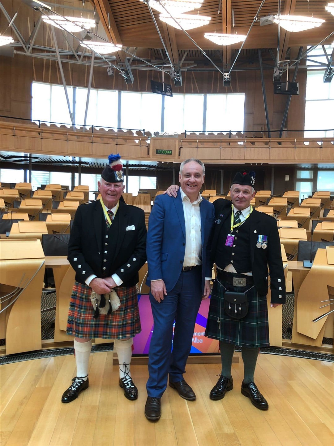 Mike Christie (left) and Geordie Ross with Richard Lochhead in the Scottish Parliament.