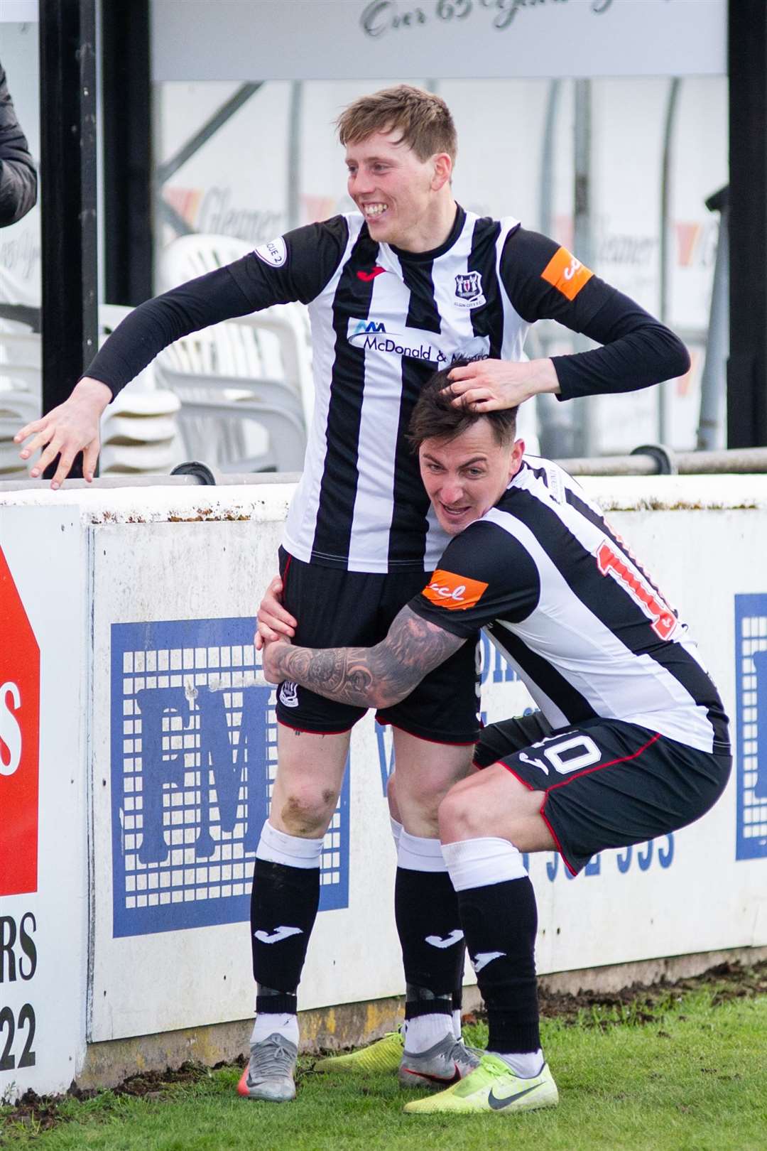 Archie Macphee gives hat-trick hero Kane Hester a lift. Picture: Daniel Forsyth..