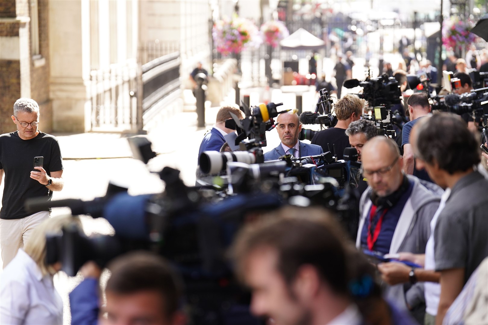 Members of the media gather outside 10 Downing Street ahead of the meeting between US President Joe Biden and Prime Minister Rishi Sunak (James Manning/PA)