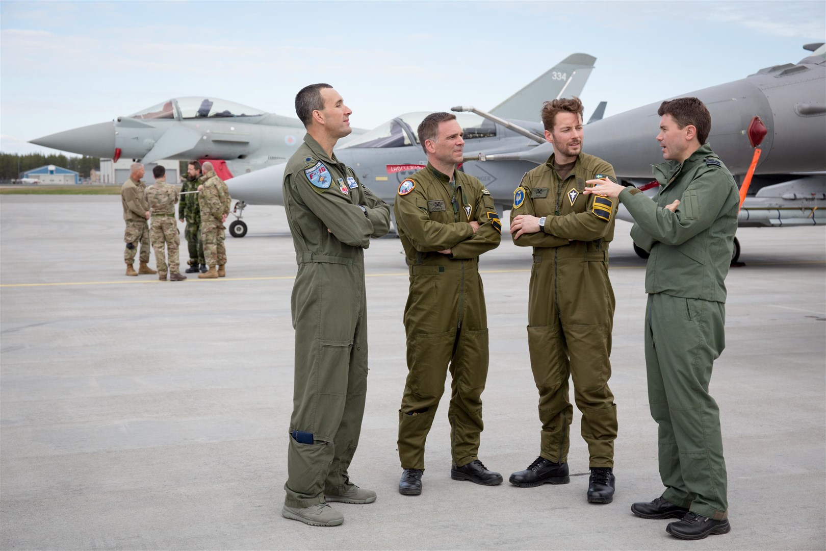 Wing Commander Matthew D'Aubyn (right) with members of the military from Sweden and the US.