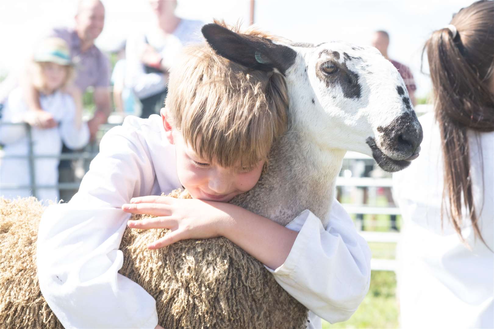 Magnus Milne gives his winning lamb a hug. Picture: Daniel Forsyth