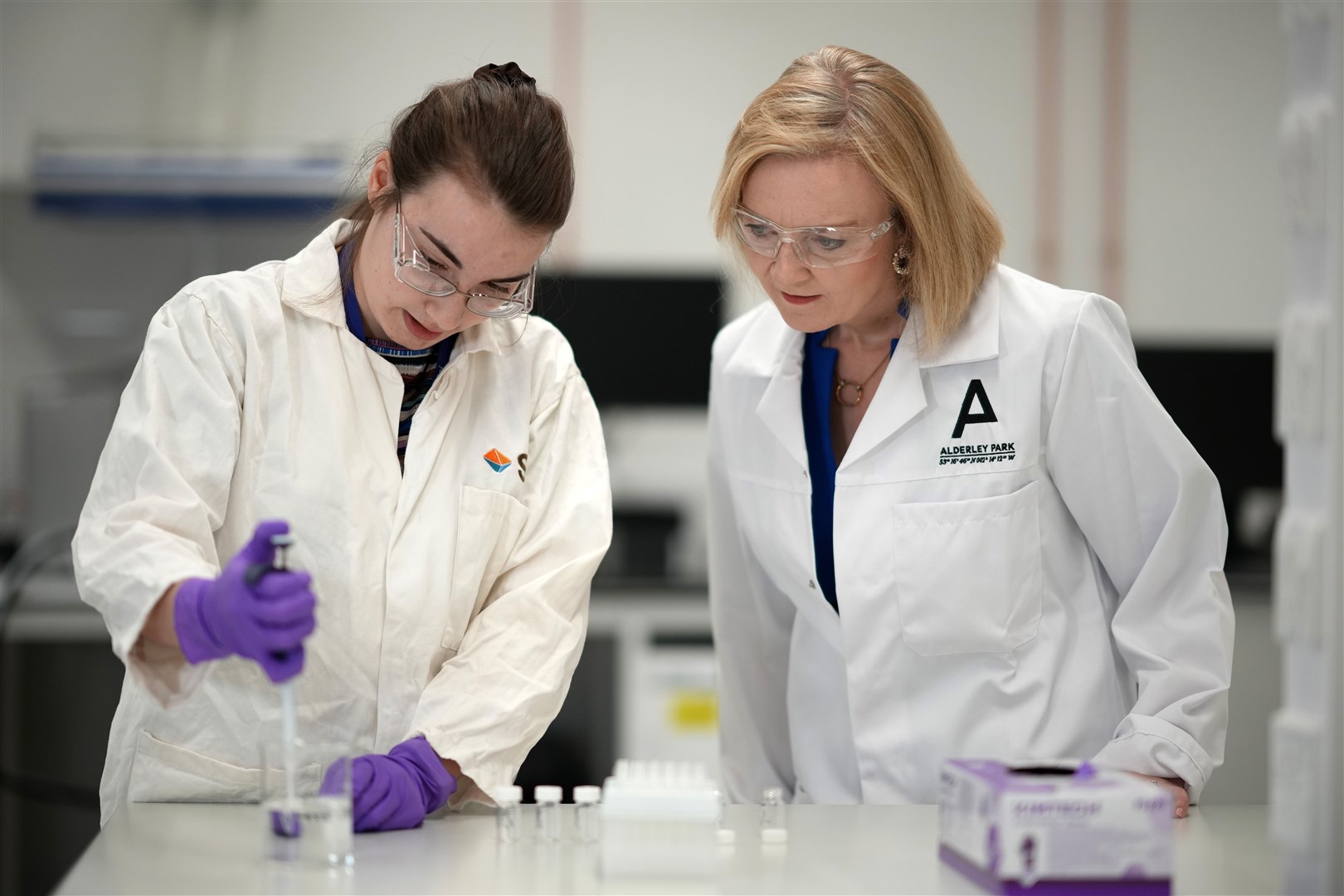 Liz Truss during a campaign visit to a life sciences laboratory at Alderley Park in Manchester (Christopher Furlong/PA)