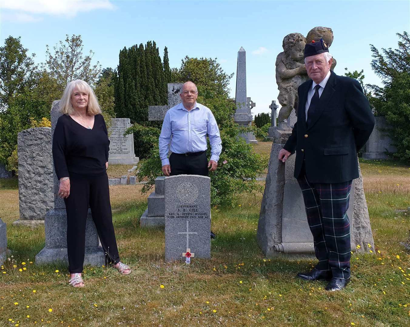 The final commemoration in Elgin Cemetery with (from left) Fiona Fraser, one of the centenary project’s most dedicated volunteers, Derek Bird, WFA Scotland (North) branch chairman, and Lord Lieutenant of Moray Seymour Munro.