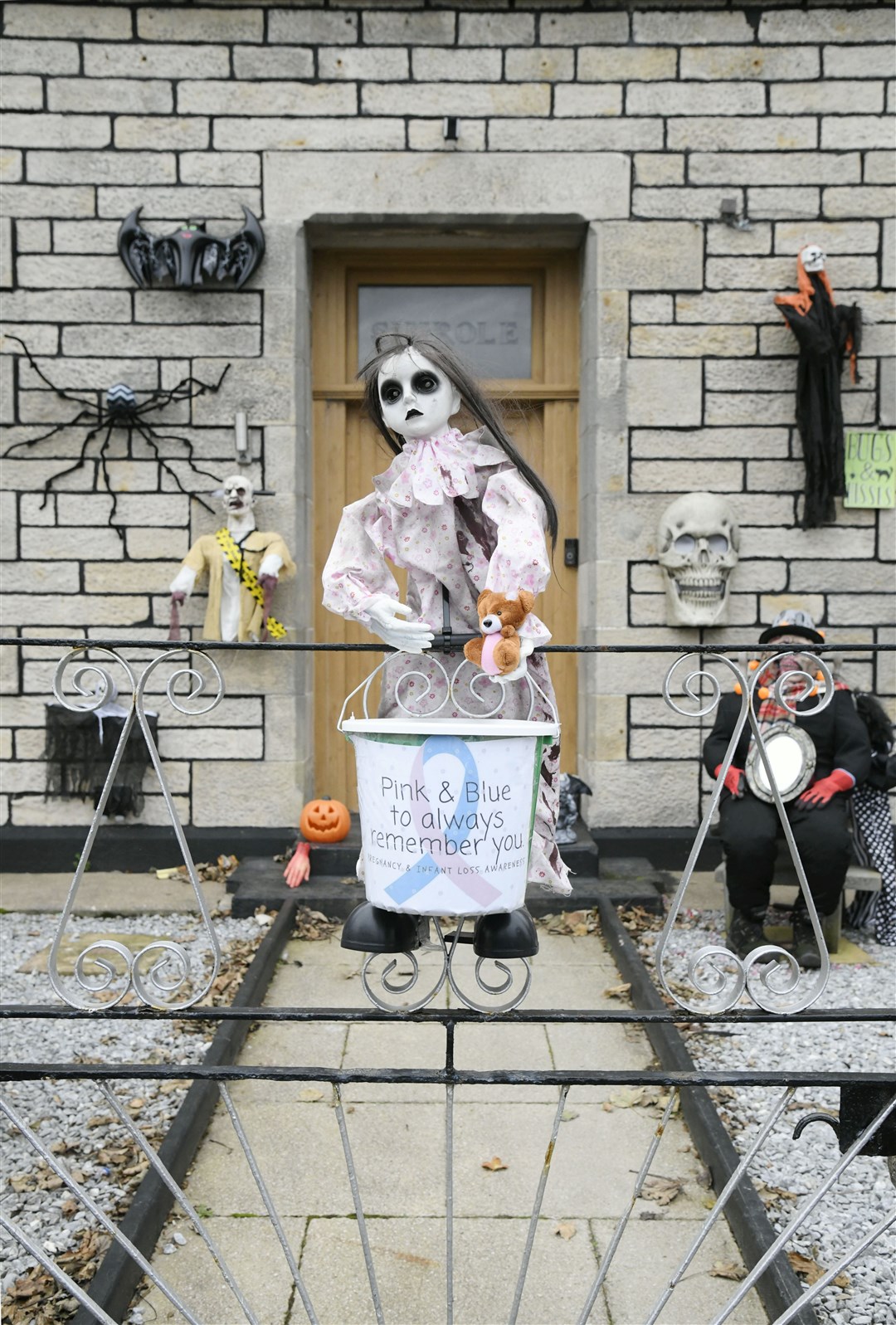 The spooky doll with the donation bucket at the Halloween house. Picture: Beth Taylor