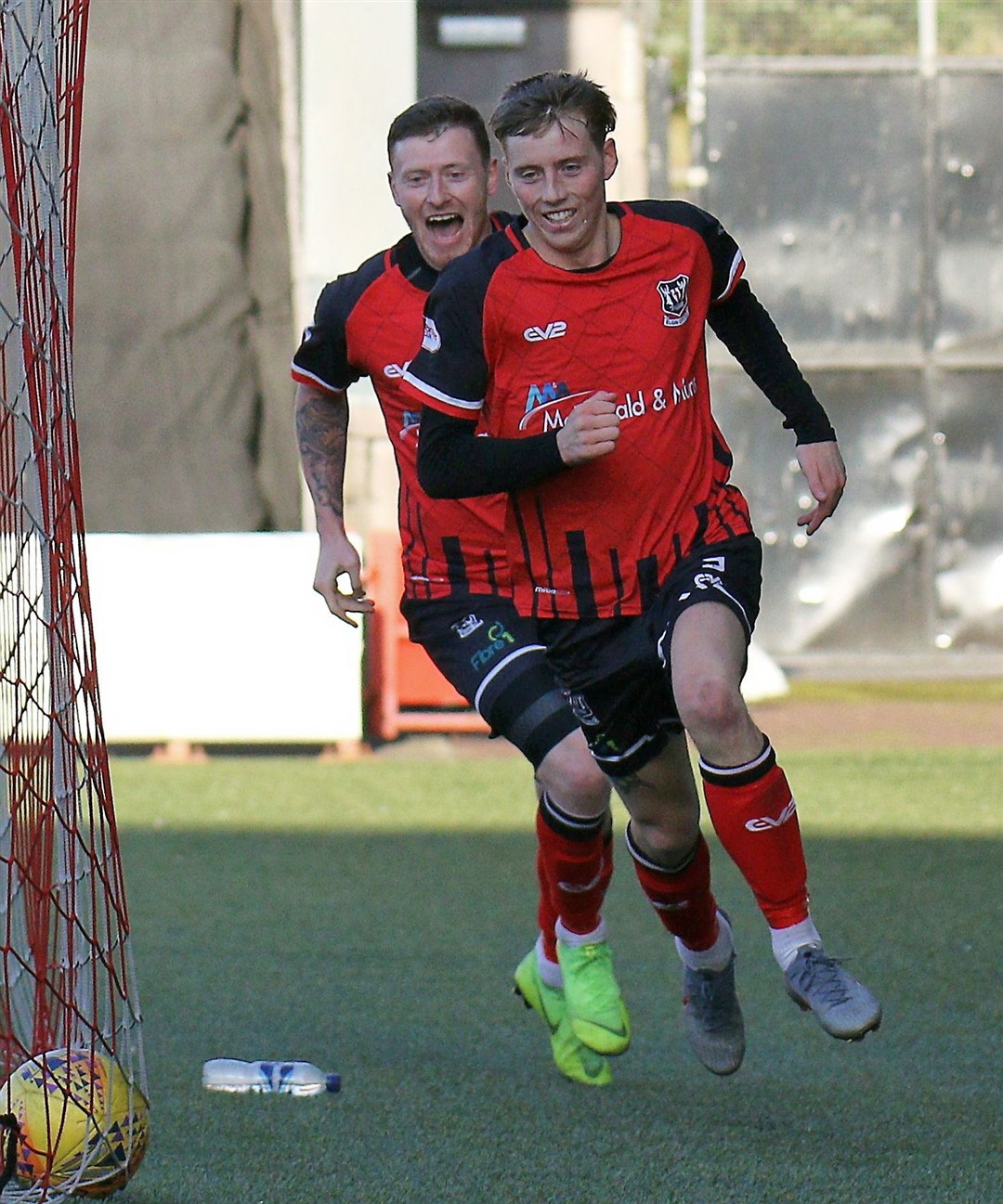 Shane Sutherland chases Elgin City team-mate Kane Hester after his goal in the 2-0 Challenge Cup win at Airdrie. Photo: Bob Crombie
