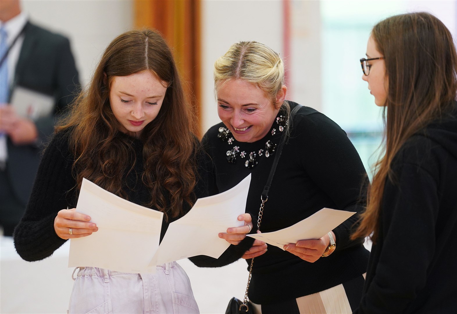 Jessica McGeown (left) opens her A-level results with her mother Samantha McGeown at Lagan College, Belfast (Brian Lawless/PA)