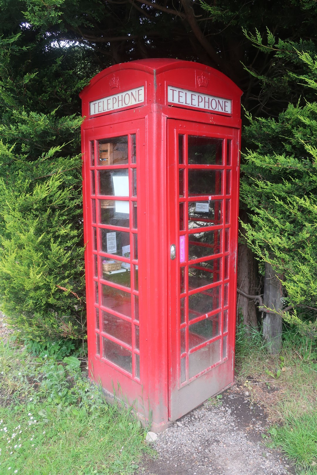 An old red phone box at Carron is now a snack shack which takes donations for hungry or thirsty passers-by.