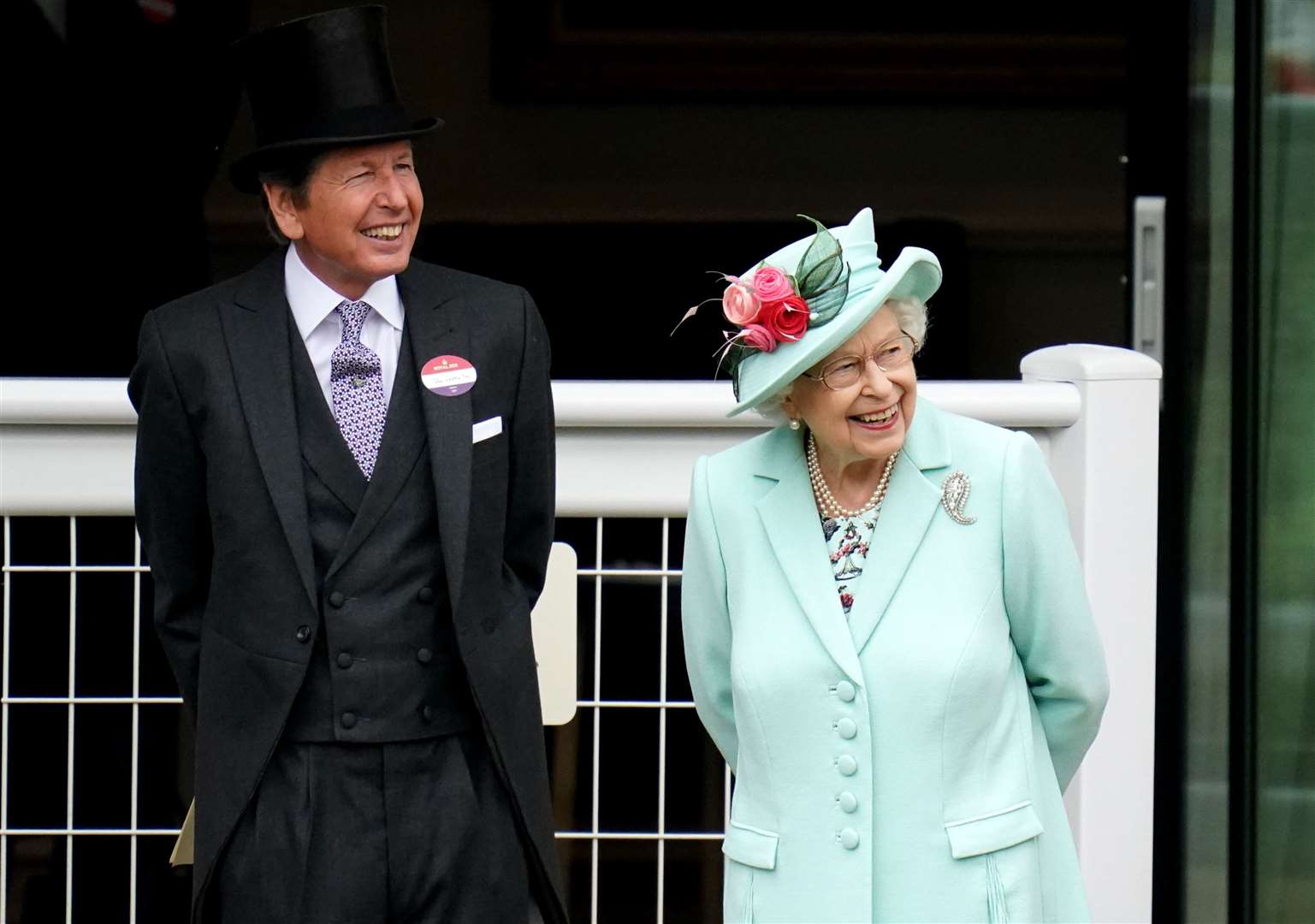 Racing manager John Warren joins the Queen during day five at Ascot (Andrew Matthews/PA)