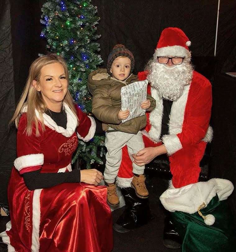Lynnie and grandson Lewis Craig with Santa.