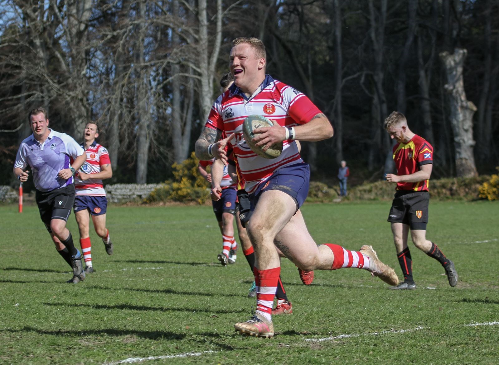 Lewis Scott smiles as he runs in try. Picture: John MacGregor