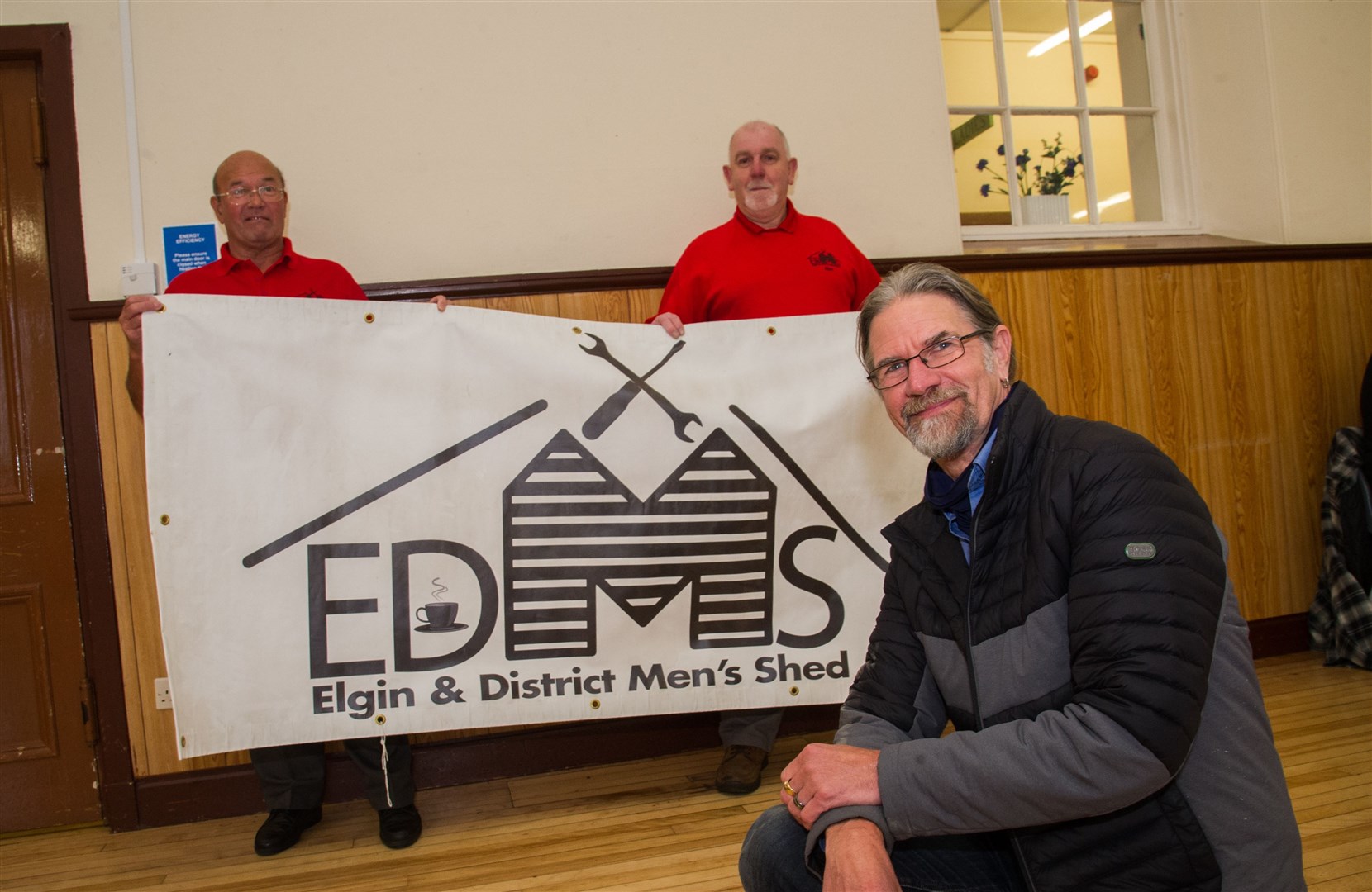 Peter Harris (left) and Alan Baillie (back), of Elgin and District Men's Shed, with Jason Schroeder, Scottish Men's Shed Association founder, at the Elgin meeting. Picture: Becky Saunderson.