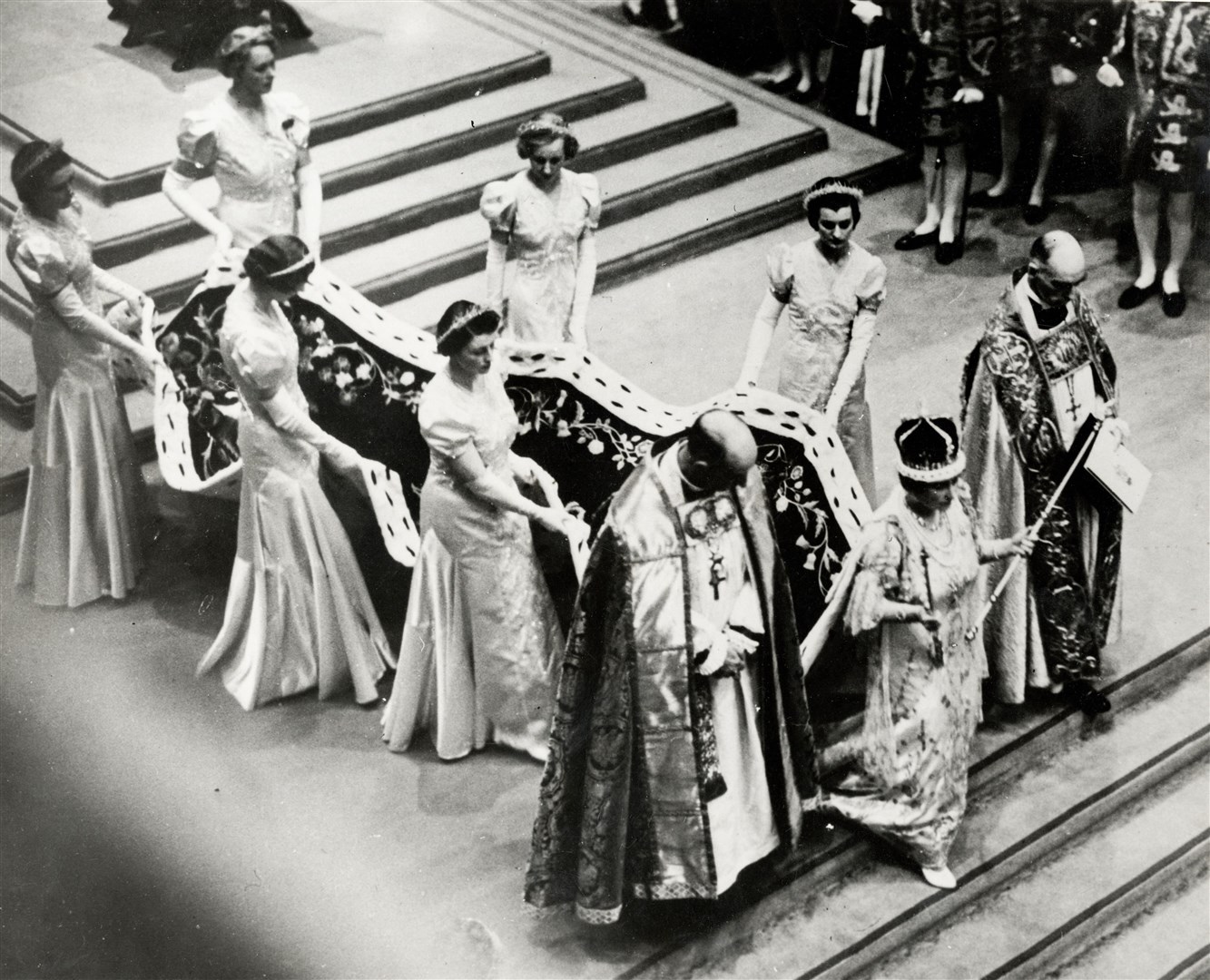 Queen Elizabeth (later the Queen Mother) holding her two sceptres at George VI’s coronation in 1937 (Pump Park Vintage Photography/Alamy/PA)