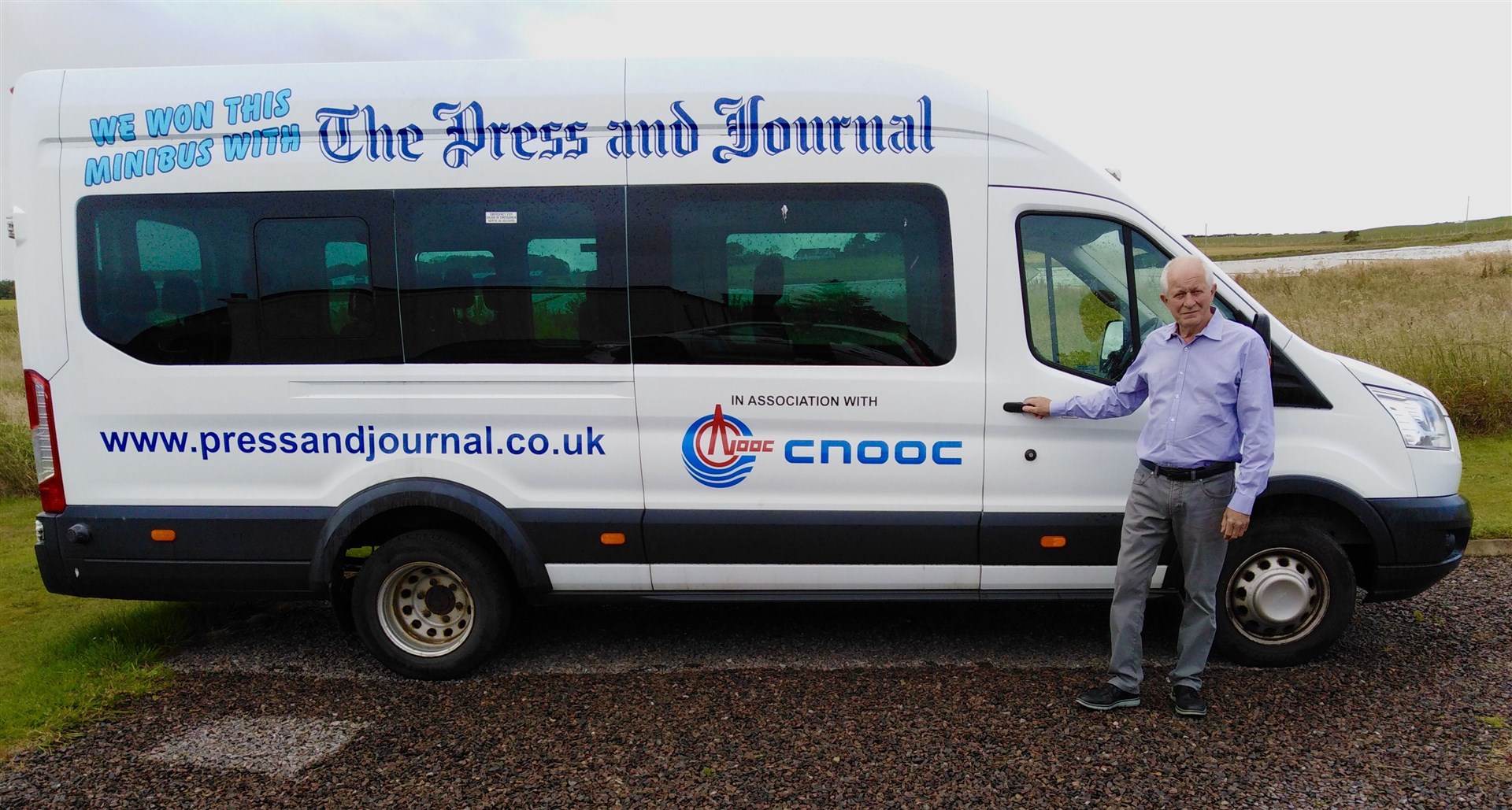 Jim Patterson by the minibus. It's planned to use this to transport villagers to the health centre in Lossiemouth.