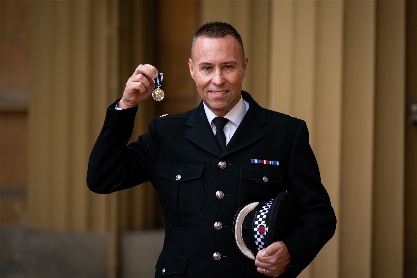 Detective Superintendent Neil Pudney after being decorated with the King’s Police Medal (Aaron Chown/PA)