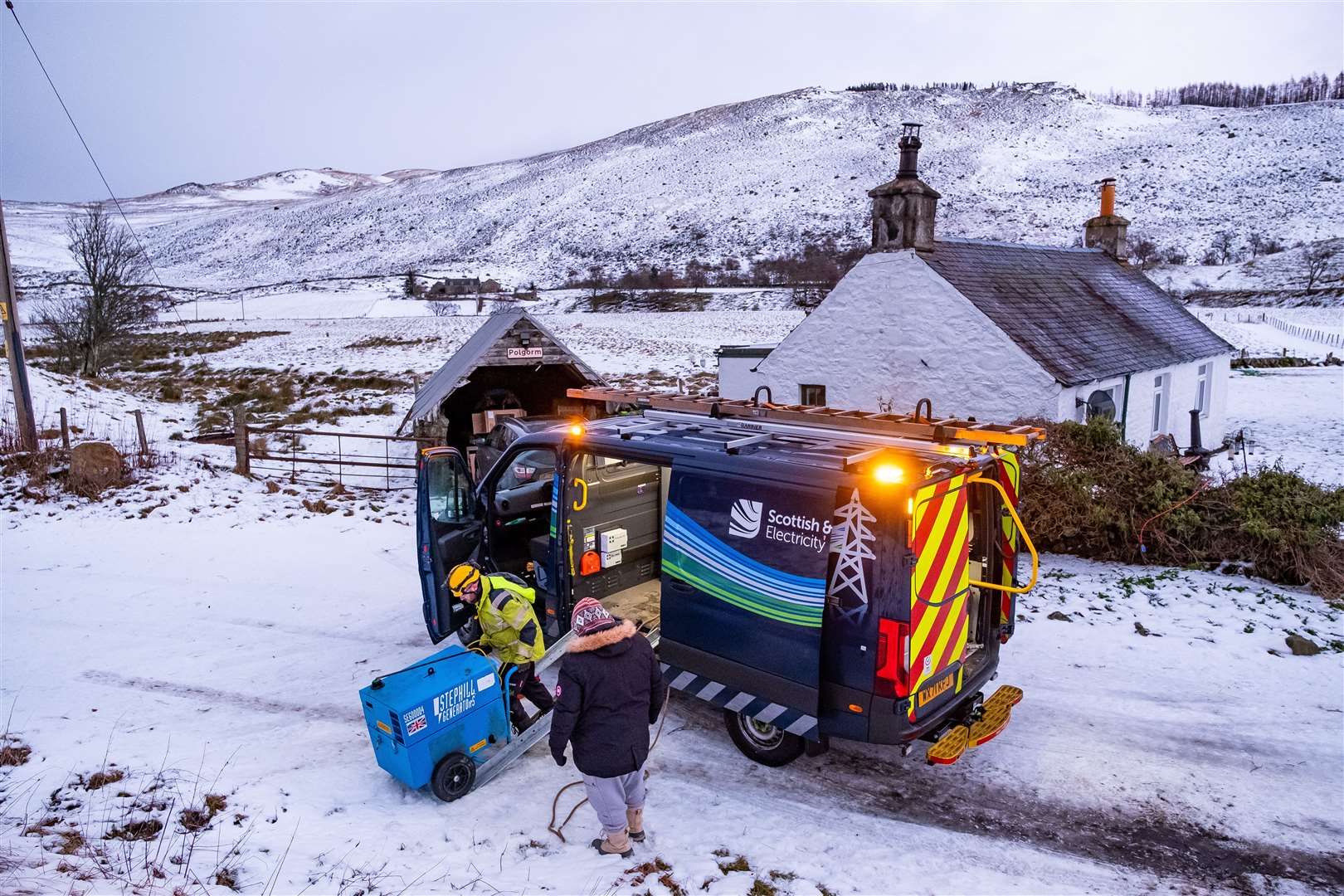 SSEN - Storm Arwen - Customer Generator Delivery Picture Shows: An SSEN engineer delivering a portable generator to a venerable family at a remote cottage in Glenshee, Monday 29 November 2021...©Stuart Nicol Photography, 2021..