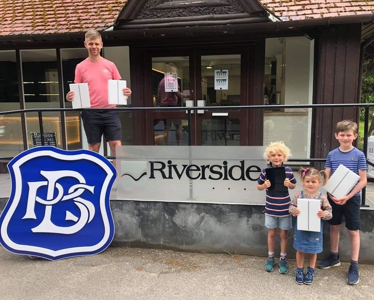 From left, Bishopmill Primary School deputy head teacher Kevin Stuart, brothers and sister Hudson and Anna, and Harris. Hudson and Harris are Bishopmill Primary pupils.