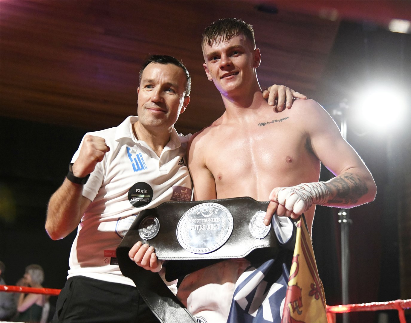 Fraser Wilkinson celebrates with his coach, Paul Gordon, as he is announced as Super Welterweight Champion...Scottish professional Super Welterweight Title at Elgin Town Hall, December 17th 2022. ..Picture: Beth Taylor.